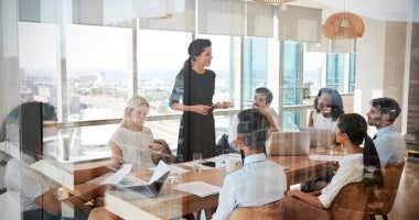 HR Manager leads a team meeting