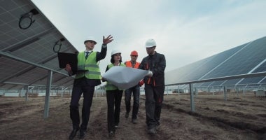 Four project managers discussing plans